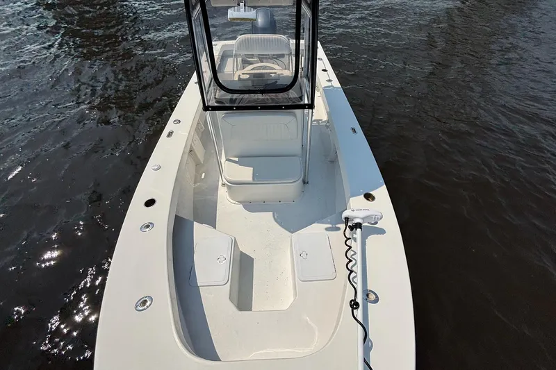 Slide: The Image of 2018 May-Craft 20 Cape Classic boat on water, featuring spacious deck and console. - 6