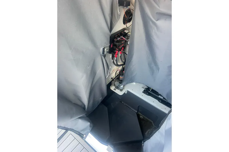 Slide: The Image of Interior view of 2024 Yamaha Boats 255 FSH Sport H, showcasing wiring and components. - 31