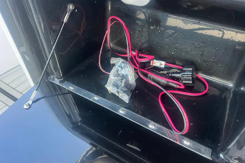 Slide: The Image of 2024 Yamaha Boats 255 FSH Sport H wiring compartment with cables and connectors. - 32
