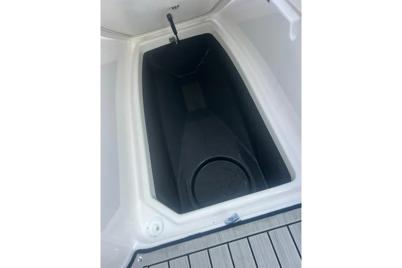 Slide: The Image of Storage compartment of 2024 Yamaha Boats 255 FSH Sport H, featuring sleek design and functionality. - 35
