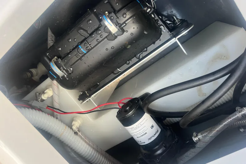 Slide: The Image of 2024 Yamaha Boats 255 FSH Sport H engine compartment with wiring and components. - 4