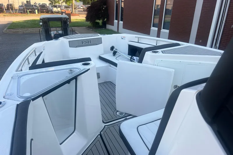 Slide: The Image of 2024 Yamaha Boats 255 FSH Sport H interior with seating and storage compartments. - 43