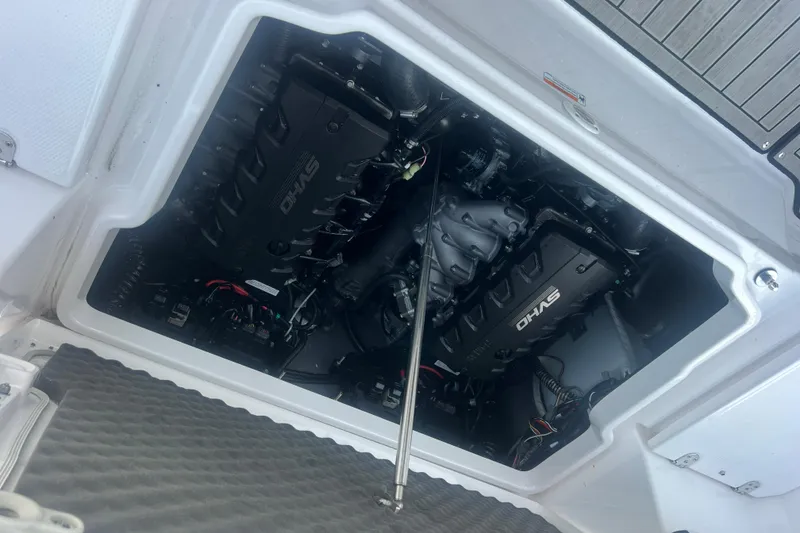Slide: The Image of Engine compartment of 2024 Yamaha Boats 255 FSH Sport H, showcasing dual engines. - 45
