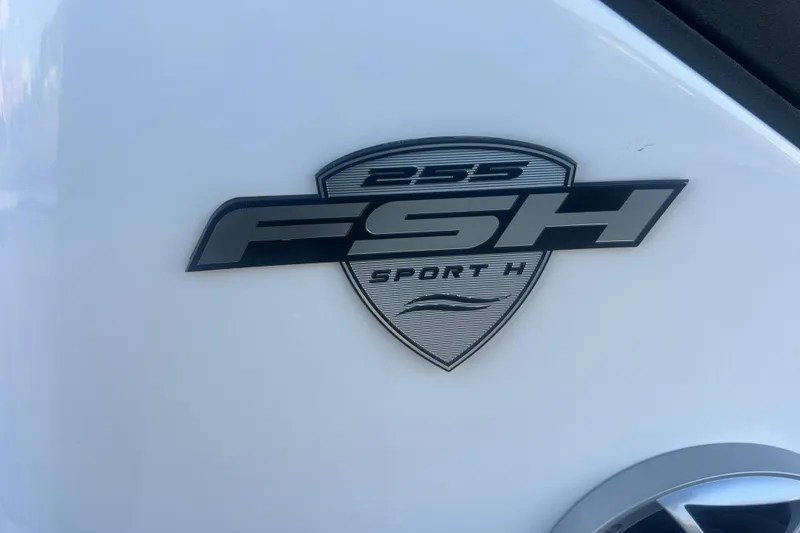 Slide: The Image of 2024 Yamaha Boats 255 FSH Sport H logo on white surface. - 48