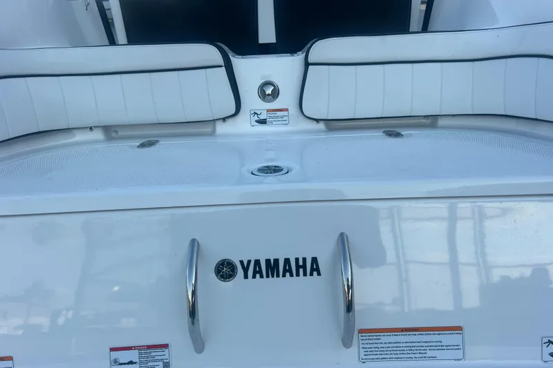 Slide: The Image of 2024 Yamaha Boats 255 FSH Sport H, rear seating and deck view. - 50