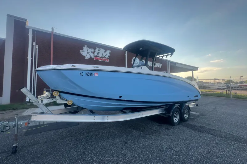 Slide: The Image of 2024 Yamaha Boats 255 FSH Sport H on trailer outside HM Boats dealership. - 59