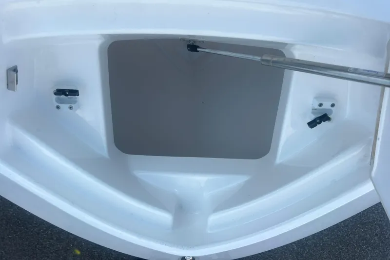 Slide: The Image of Open storage compartment on 2024 Yamaha Boats 255 FSH Sport H. - 9