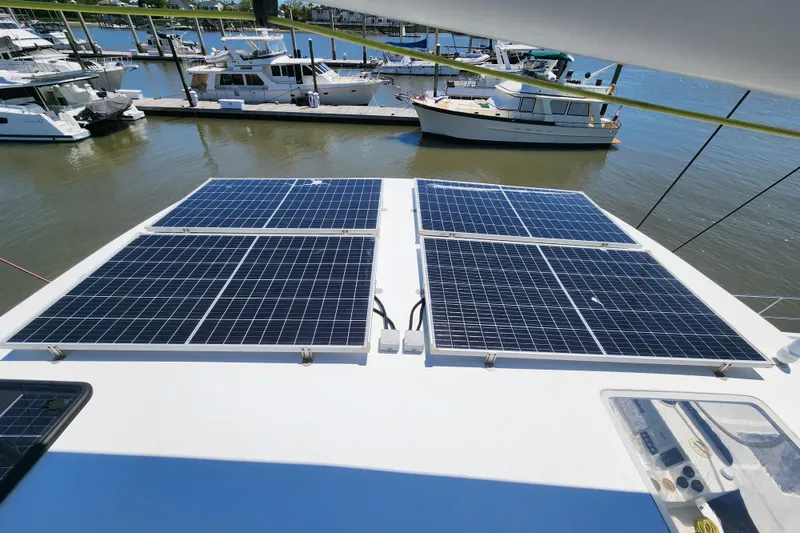 Slide: The Image of Solar panels on a 2021 Royal Cape Catamarans Majestic 570 at a marina. - 100