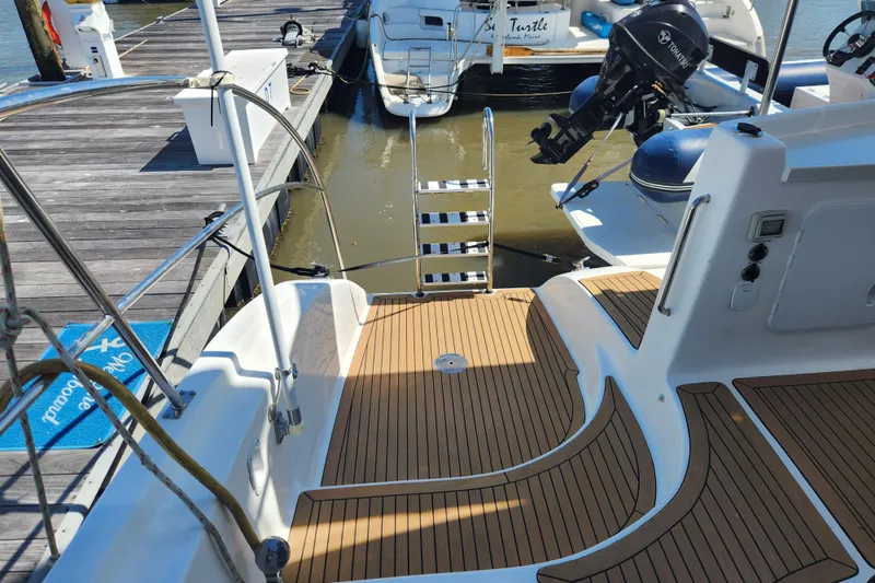 Slide: The Image of Royal Cape Catamarans Majestic 570, 2021 model, docked with teak deck and ladder. - 17