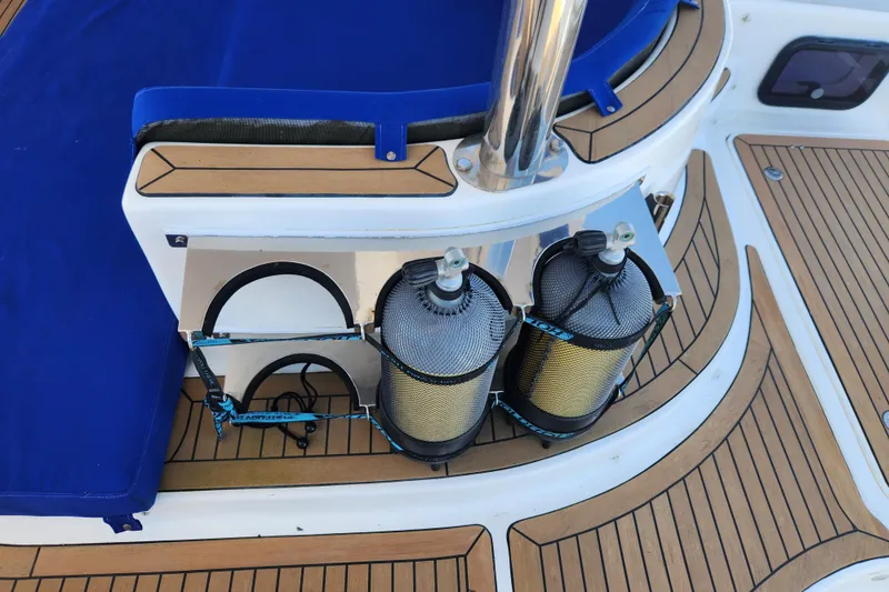 Slide: The Image of Deck of 2021 Royal Cape Catamarans Majestic 570 with scuba tanks secured. - 26