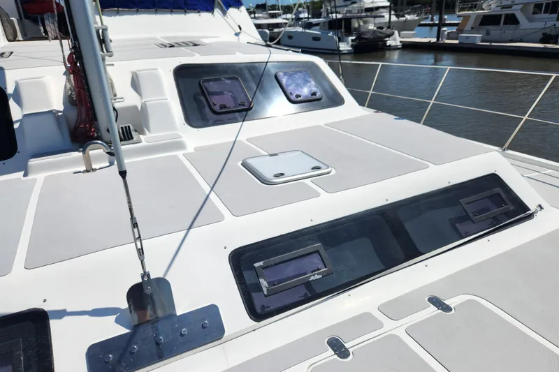 Slide: The Image of Royal Cape Catamarans Majestic 570, 2021 model, docked with visible deck and hatches. - 35