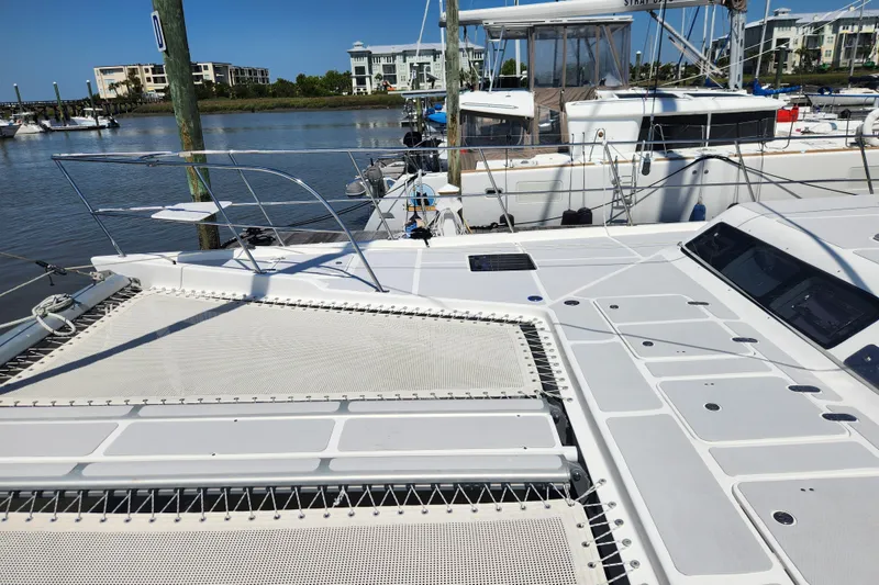Slide: The Image of 2021 Royal Cape Catamarans Majestic 570 docked, showcasing spacious deck and modern design. - 42