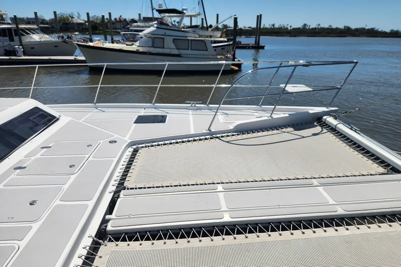 Slide: The Image of Catamaran deck view of 2021 Royal Cape Majestic 570 at marina. - 43