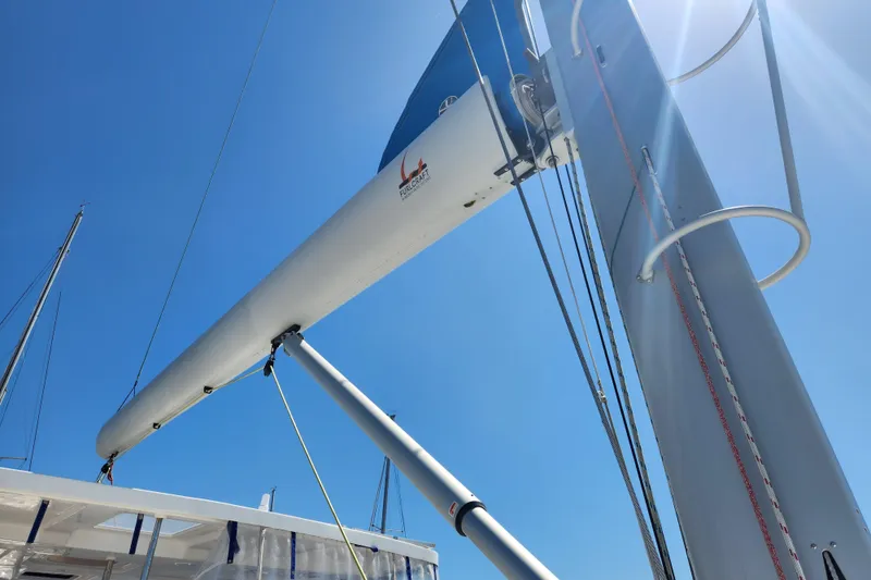 Slide: The Image of Royal Cape Catamarans Majestic 570 mast and boom against clear blue sky, 2021 model. - 47
