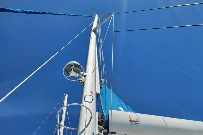 Slide: The Image of Mast and rigging of 2021 Royal Cape Catamarans Majestic 570 against clear blue sky. - 49
