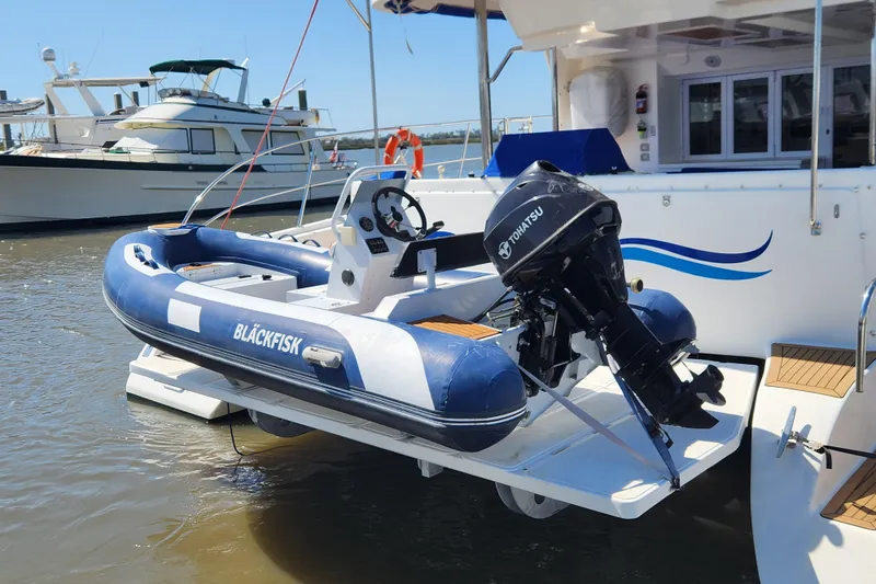 Slide: The Image of Inflatable boat with Tohatsu motor on 2021 Royal Cape Catamarans Majestic 570. - 5