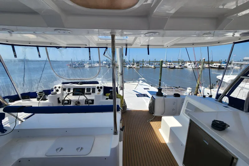 Slide: The Image of Cockpit view of 2021 Royal Cape Catamarans Majestic 570 at marina. - 50