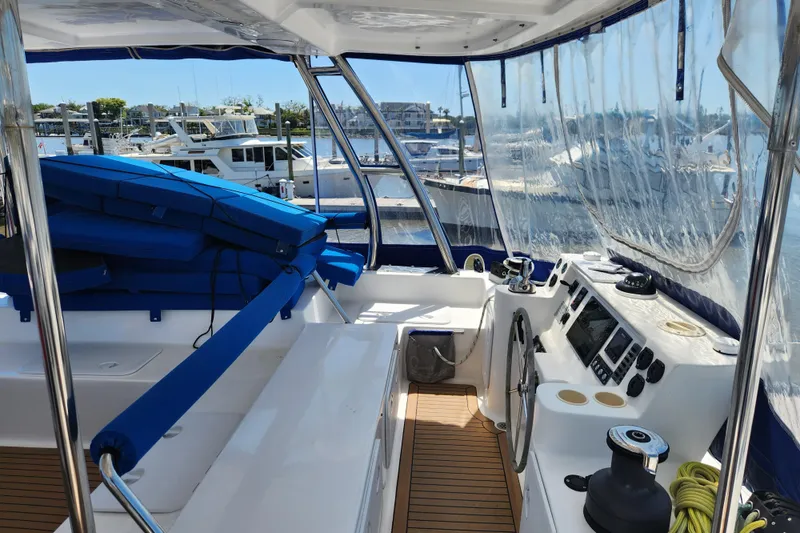 Slide: The Image of Cockpit of 2021 Royal Cape Catamarans Majestic 570 with navigation equipment and seating. - 51