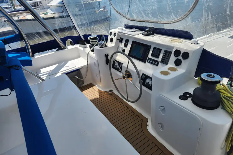Slide: The Image of Cockpit of 2021 Royal Cape Catamarans Majestic 570 with navigation controls and seating. - 52