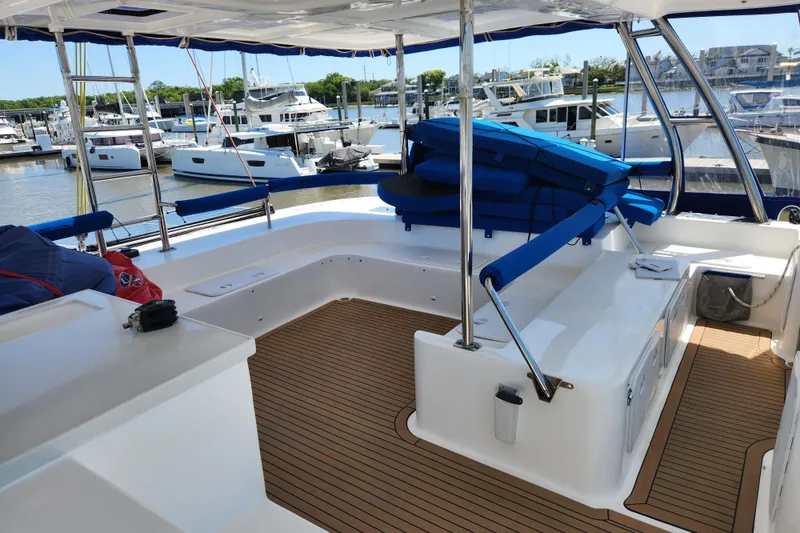Slide: The Image of Spacious deck of 2021 Royal Cape Catamarans Majestic 570 in marina setting. - 59