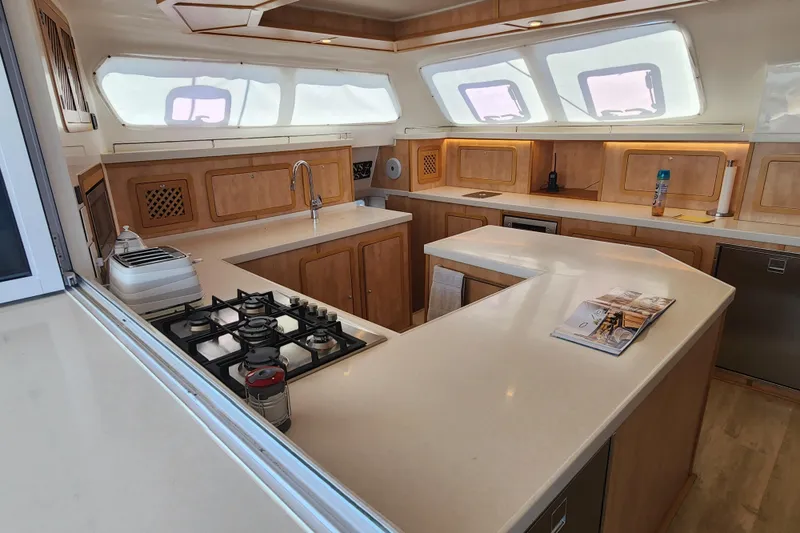Slide: The Image of Luxurious kitchen interior of 2021 Royal Cape Catamarans Majestic 570 with modern amenities. - 62