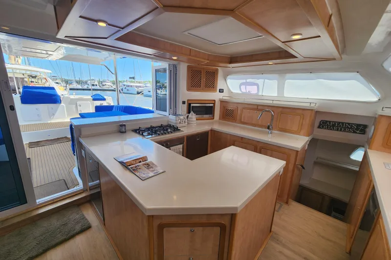 Slide: The Image of Luxurious 2021 Royal Cape Catamarans Majestic 570 kitchen with modern amenities and spacious design. - 63