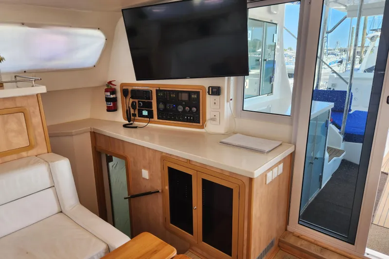 Slide: The Image of Interior of 2021 Royal Cape Catamarans Majestic 570 with control panel and TV. - 67