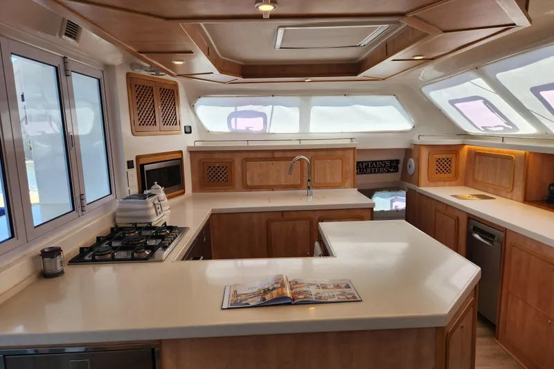 Slide: The Image of Luxurious kitchen interior of 2021 Royal Cape Catamarans Majestic 570 with modern amenities. - 68