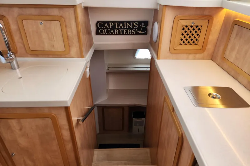 Slide: The Image of Interior of 2021 Royal Cape Catamarans Majestic 570, featuring a cozy captain's quarters entrance. - 72