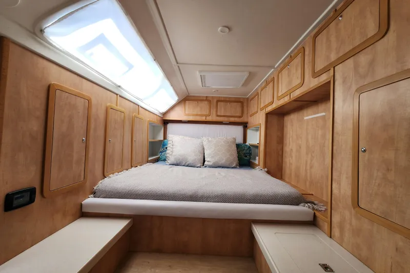 Slide: The Image of Luxurious cabin interior of 2021 Royal Cape Catamarans Majestic 570 with cozy bedding. - 75
