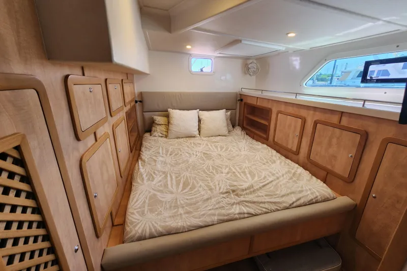 Slide: The Image of Luxurious cabin interior of 2021 Royal Cape Catamarans Majestic 570 with cozy bedding. - 80