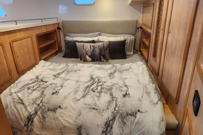 Slide: The Image of Luxurious cabin interior of 2021 Royal Cape Catamarans Majestic 570 with elegant bedding. - 86