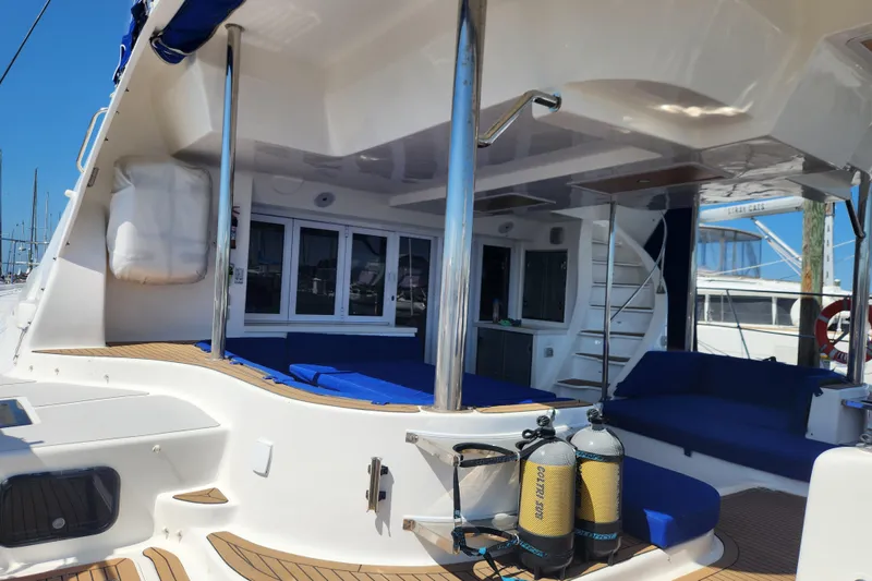Slide: The Image of 2021 Royal Cape Catamarans Majestic 570 yacht interior with seating and scuba tanks. - 9