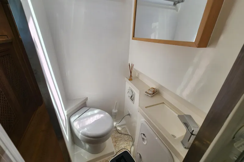 Slide: The Image of Compact bathroom in 2021 Royal Cape Catamarans Majestic 570, featuring modern fixtures and minimalist design. - 93