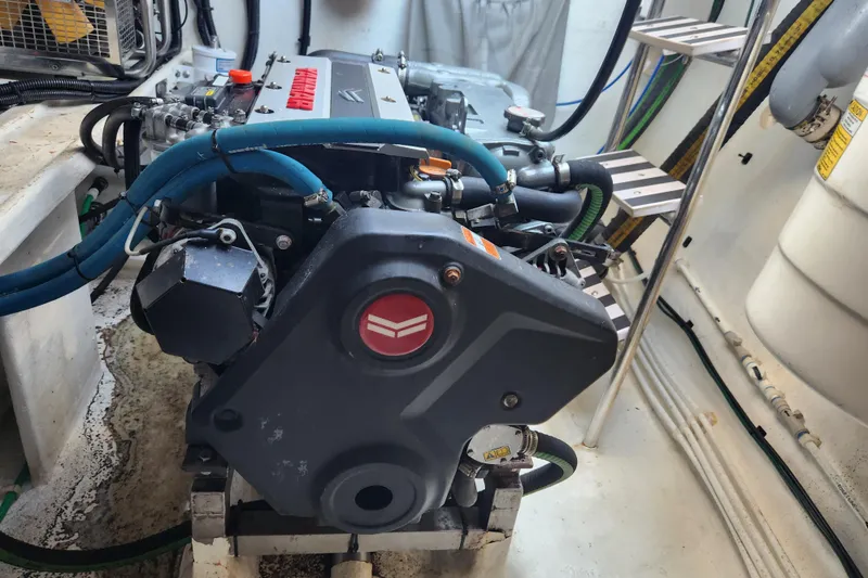 Slide: The Image of Engine room of 2021 Royal Cape Catamarans Majestic 570 with visible machinery and components. - 95