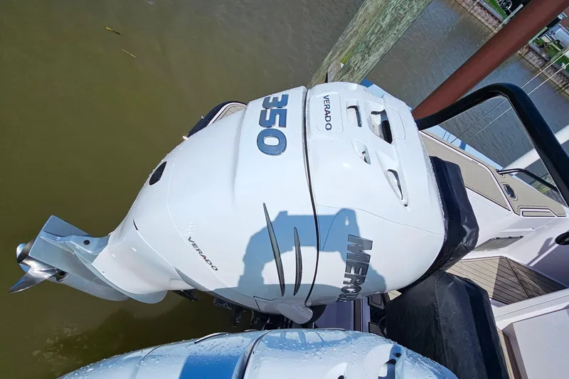 Slide: The Image of Outboard engine of 2023 Axopar 37 XC Cross Cabin boat on water. - 10