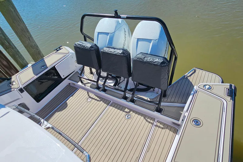 Slide: The Image of 2023 Axopar 37 XC Cross Cabin boat with twin engines and spacious deck. - 17