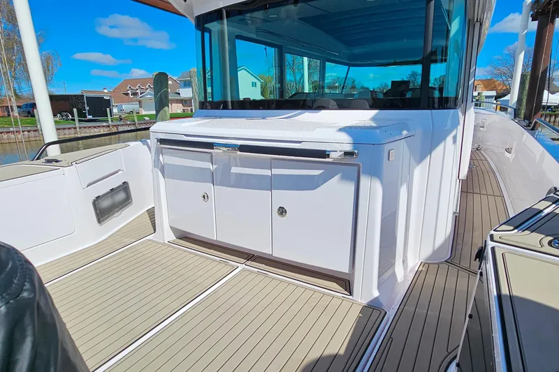 Slide: The Image of 2023 Axopar 37 XC Cross Cabin boat deck with sleek design and modern features. - 18