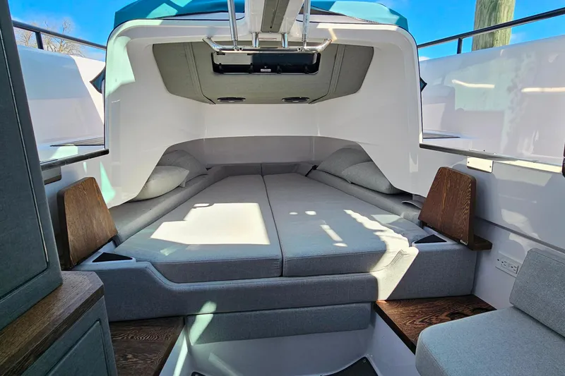 Slide: The Image of 2023 Axopar 37 XC Cross Cabin interior with cozy sleeping area and modern design. - 45