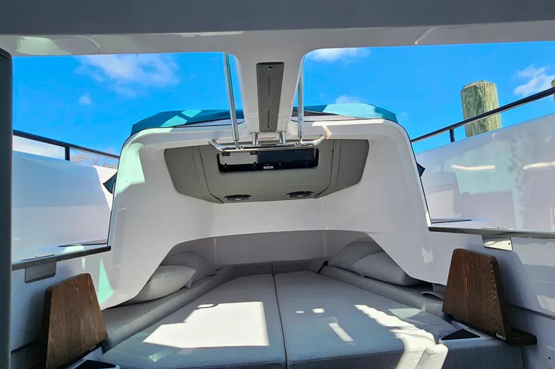 Slide: The Image of Interior view of 2023 Axopar 37 XC Cross Cabin with skylight and seating. - 46