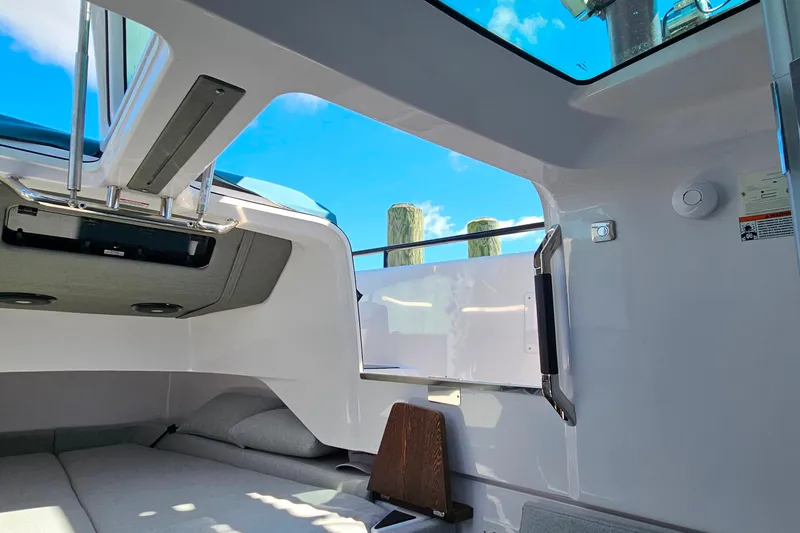 Slide: The Image of Interior view of 2023 Axopar 37 XC Cross Cabin with skylight and modern design. - 47
