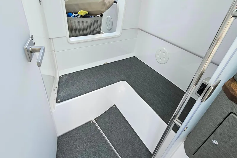 Slide: The Image of Interior view of 2023 Axopar 37 XC Cross Cabin with modern design and storage basket. - 49
