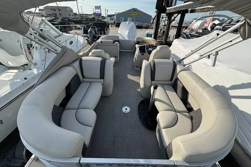 Slide: The Image of 2023 Sylvan Mirage 8522 LZ pontoon boat with spacious seating and modern design. - 11