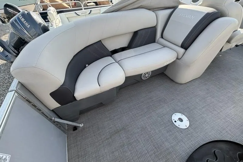 Slide: The Image of 2023 Sylvan Mirage 8522 LZ boat interior with plush seating and Yamaha engine. - 12