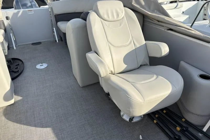 Slide: The Image of 2023 Sylvan Mirage 8522 LZ boat interior with plush seating and modern design. - 16