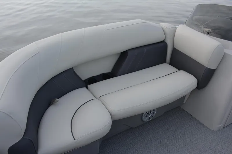Slide: The Image of Manufacturer Provided Image: 2023 Sylvan Mirage 8522 LZ boat interior seating with gray and white upholstery. - 7