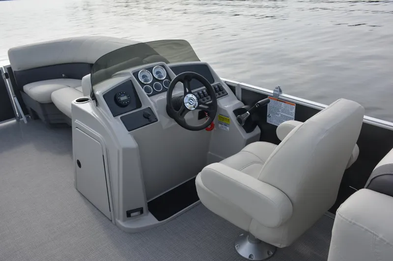 Slide: The Image of Manufacturer Provided Image: 2023 Sylvan Mirage 8522 LZ boat interior with steering console and seating. - 9