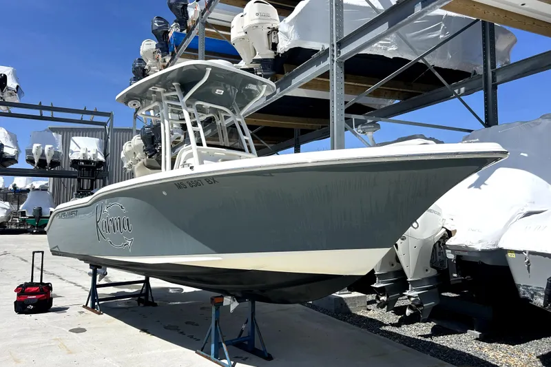 The Image of 2022 Key West 239 FS boat in storage, featuring sleek design and modern equipment. - 0