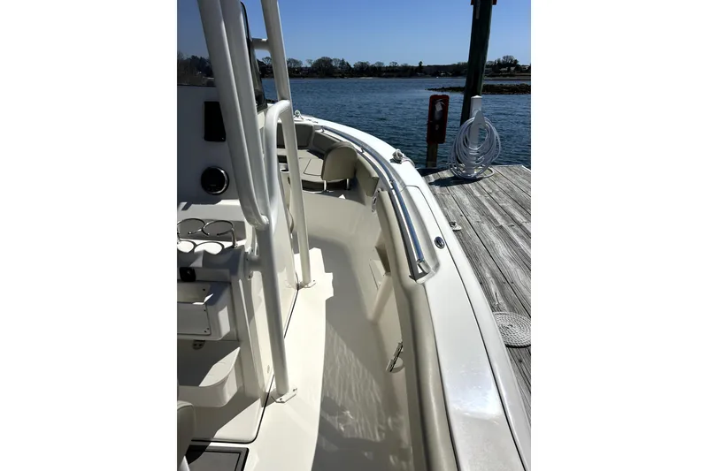 Slide: The Image of 2022 Key West 239 FS boat docked by the water on a sunny day. - 4