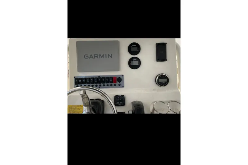 Slide: The Image of Dashboard of 2022 Key West 239 FS boat featuring Garmin navigation system. - 6